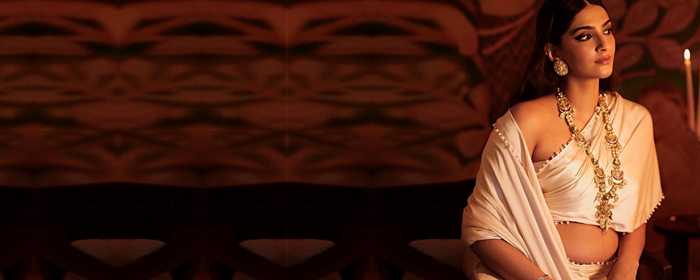 Sonam Kapoor Flaunts Her Baby Bump In A Regal White Ensemble